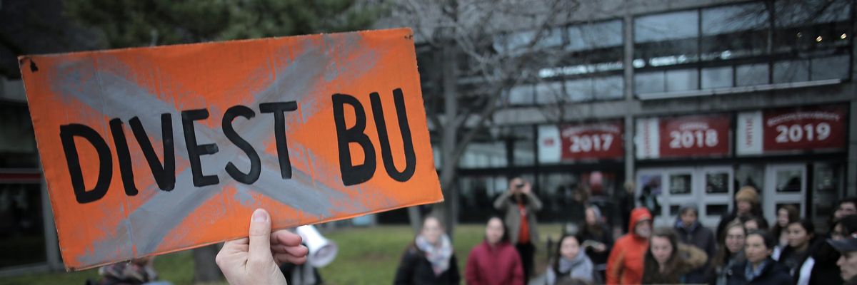 ​A group of Boston University students walk out of classes on January 23, 2017 to launch a campaign urging BU president Robert Brown to divest the university's endowment from fossil fuel companies.