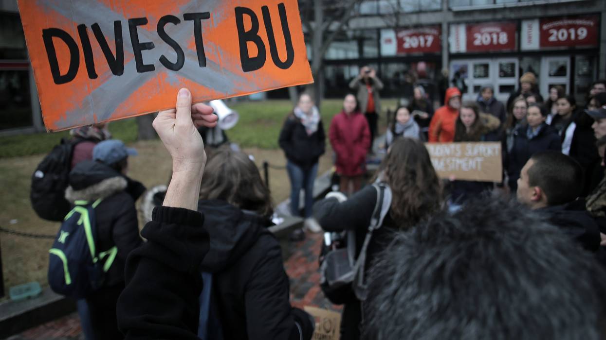 A group of Boston University students walk out of classes on January 23, 2017 to launch a campaign urging BU president Robert Brown to divest the university's endowment from fossil fuel companies.