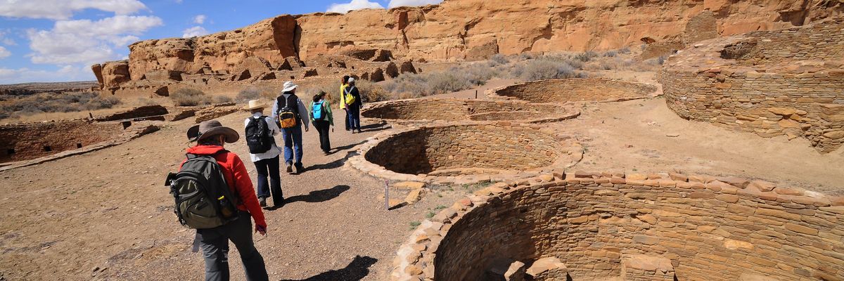 A guide leads a group of visitors