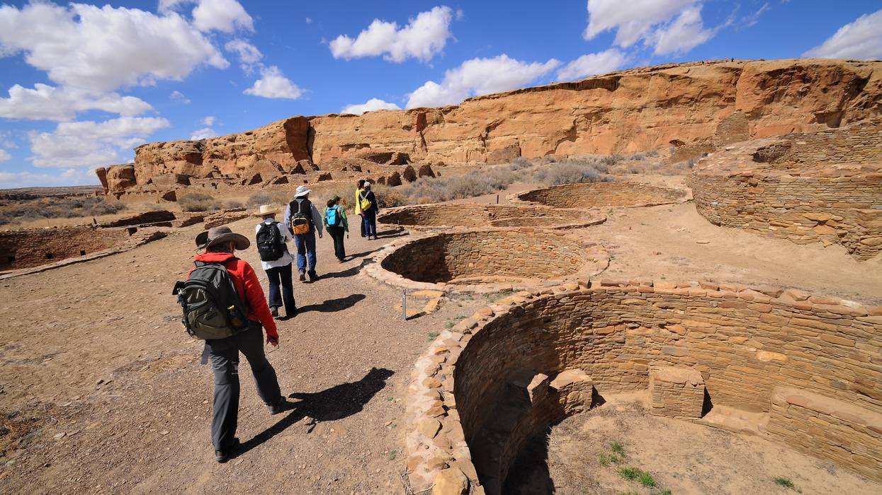 A guide leads a group of visitors