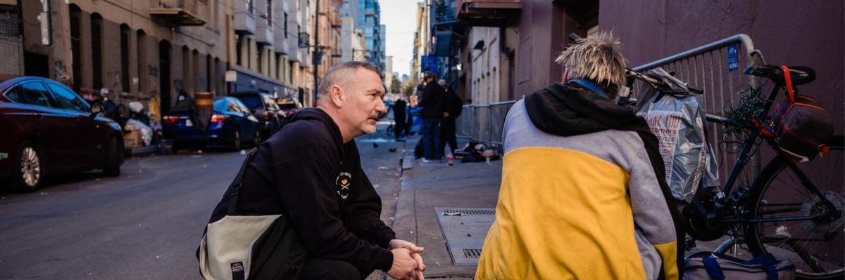 A harm reduction worker speaks to people on the streets of San Francisco