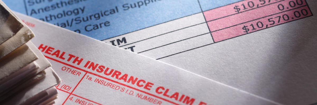 A health insurance claim form is seen on a medical bill.
