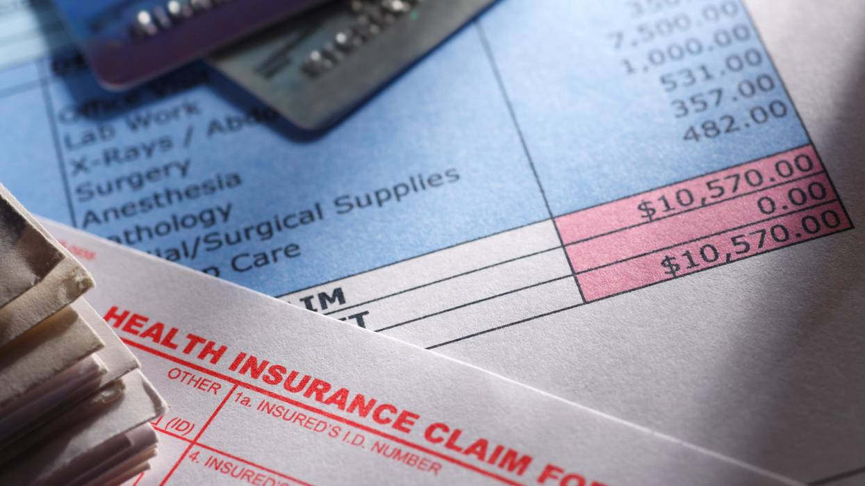 A health insurance claim form is seen on a medical bill.
