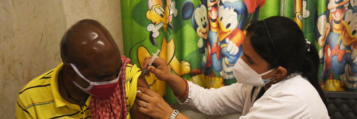 A health worker administers a dose of the Covid-19 vaccine on June 9, 2021 in New Delhi, India. (Photo: Sonu Mehta/Hindustan Times via Getty Images)