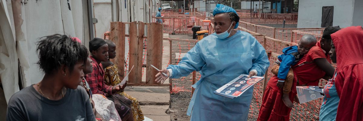 A health worker educates patients at an Mpox treatment center