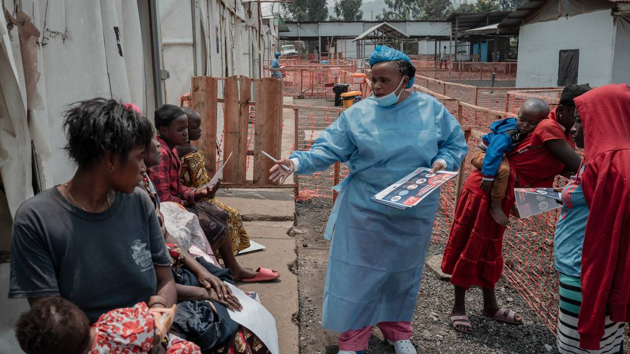 A health worker educates patients at an Mpox treatment center