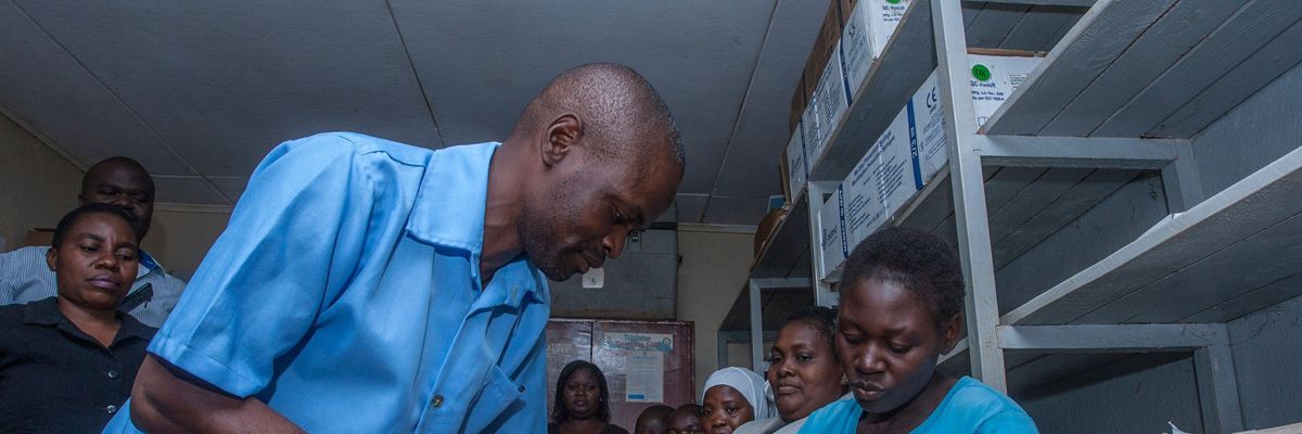A health worker prepares to give a dose of a malaria vaccine on April 23, 2019 at a hospital in Malawi's capital district of Lilongwe.