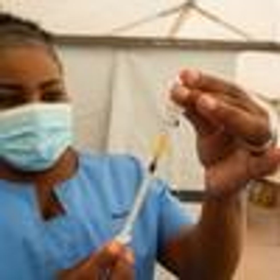 A healthcare worker prepares a coronavirus vaccine dose