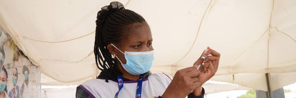 A healthcare worker prepares a coronavirus vaccine dose