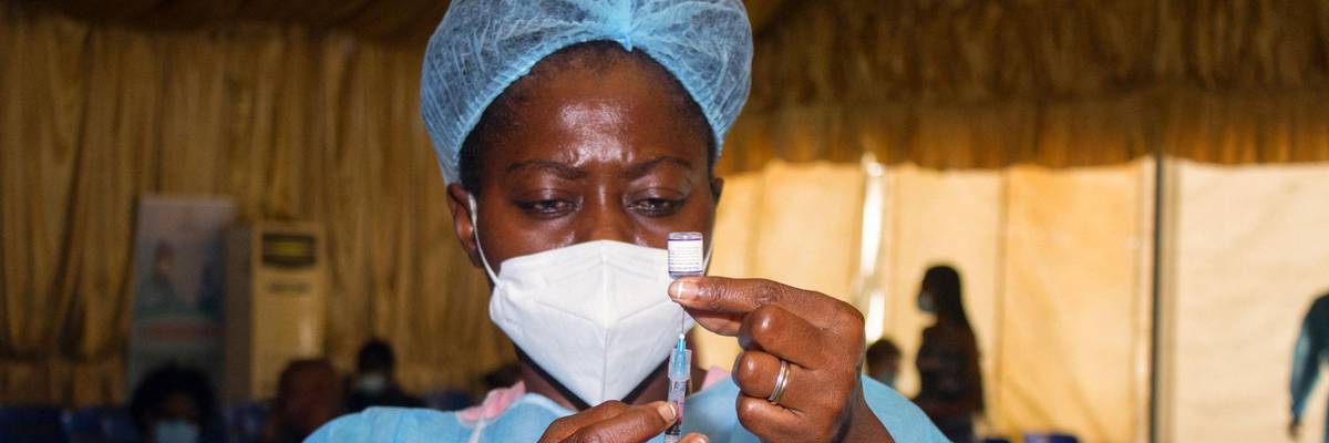 A healthcare worker prepares a coronavirus vaccine dose