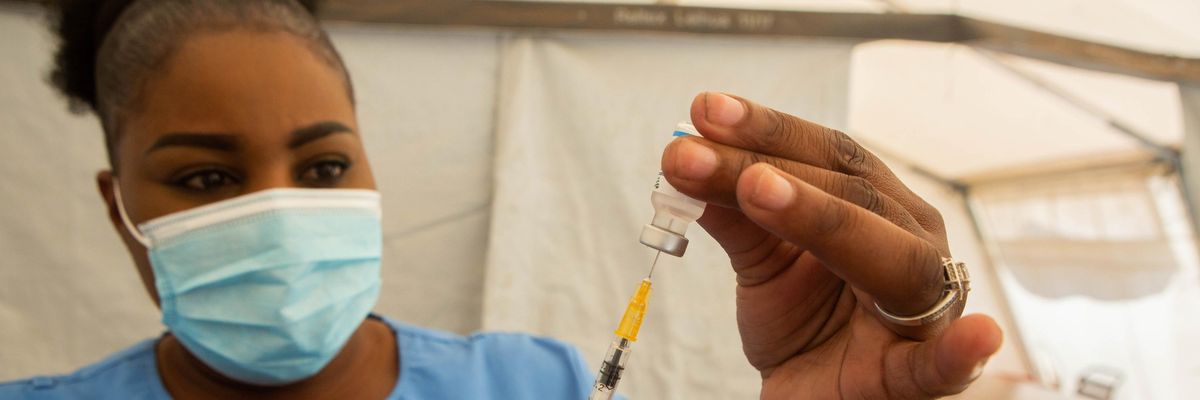 A healthcare worker prepares a coronavirus vaccine dose