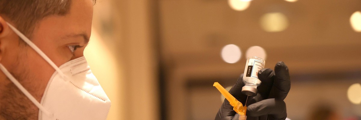 A healthcare worker prepares a Covid-19 vaccine