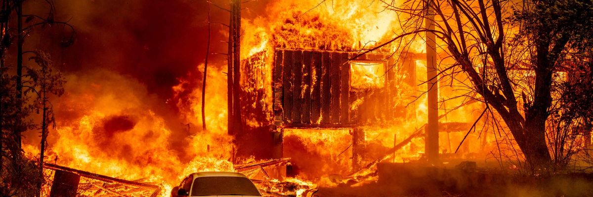 A home is engulfed in flames as the Dixie Fire rages on in Greenville, California