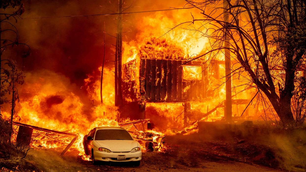 A home is engulfed in flames as the Dixie Fire rages on in Greenville, California