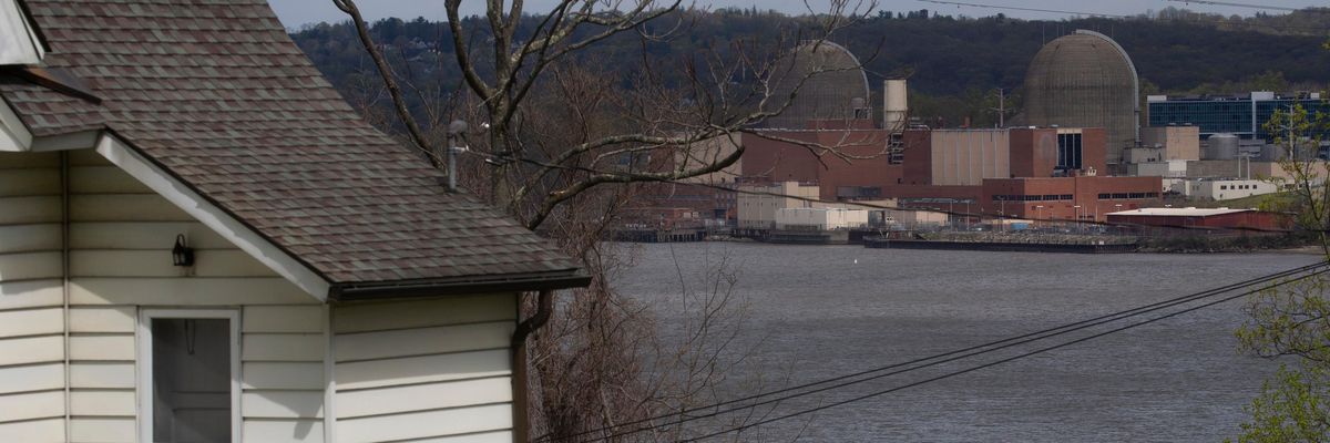 A home is seen across the Hudson River from the decommissioned Indian Point nuclear power plant