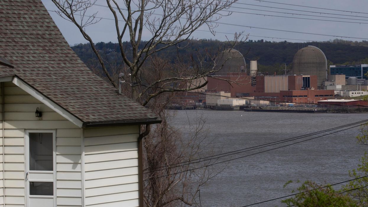 A home is seen across the Hudson River from the decommissioned Indian Point nuclear power plant
