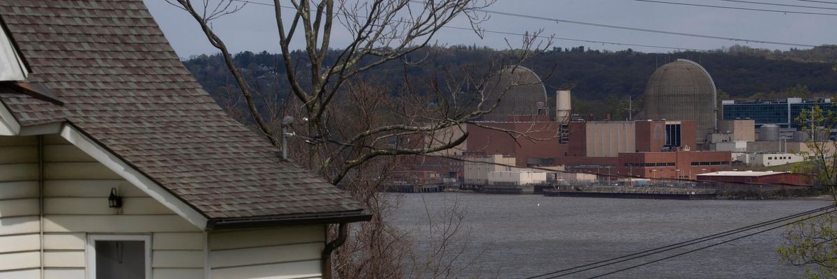 A home is seen across the Hudson River from the decommissioned Indian Point nuclear power plant