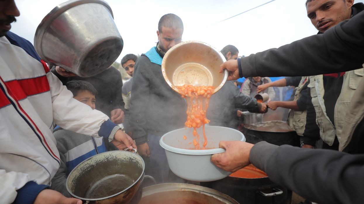 a hot meal distribution in the Nuseirat refugee camp.