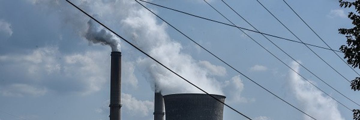A house is seen near the Gavin Power Plant