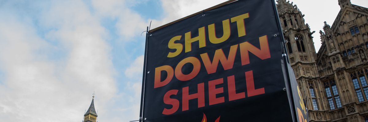 A large display from the environmental group Fossil Free London is seen during a climate protest
