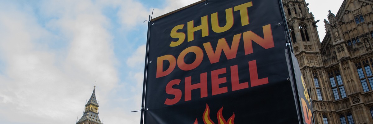 A large display from the environmental group Fossil Free London is seen during a climate protest