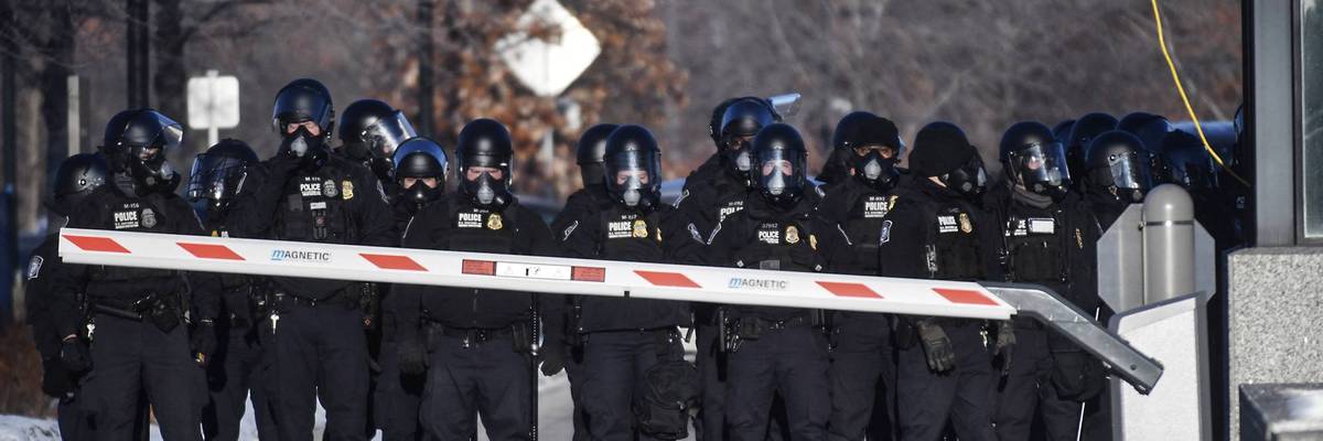 A line of DHS police.