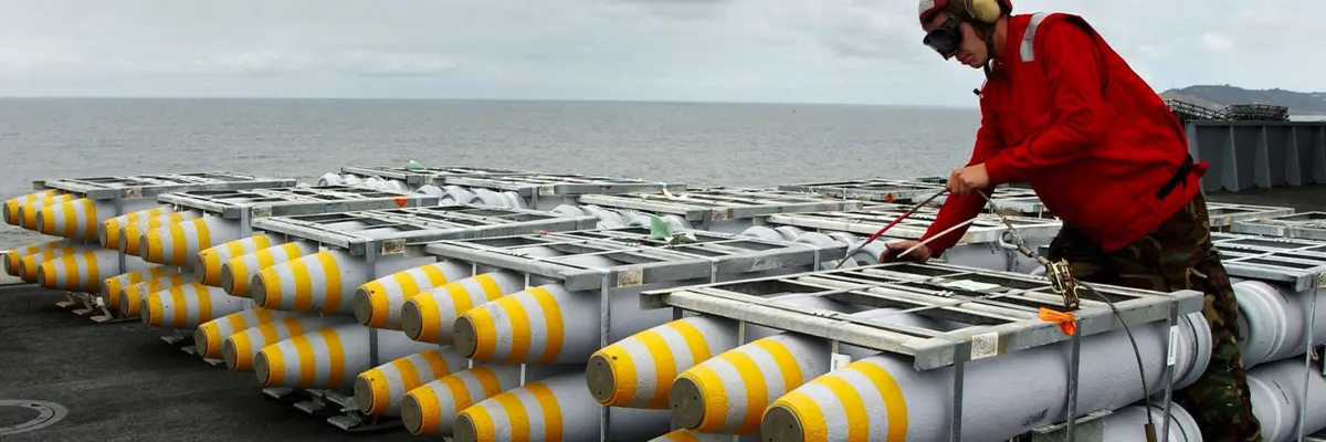 A load of 500-pound bombs is secured