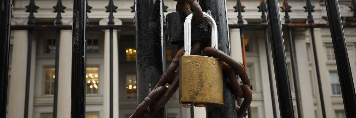 A lock is seen on a gate on the exterior of the U.S. Department of Treasury