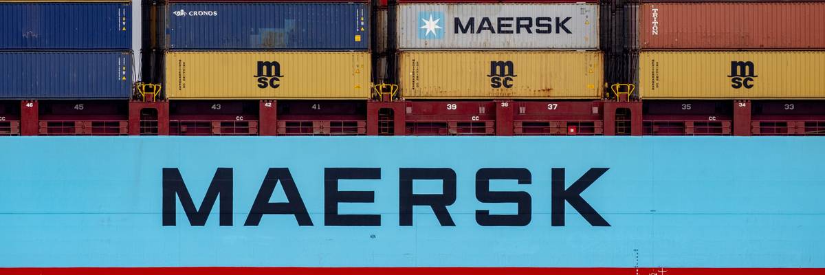 A Maersk vessel with shipping containers.