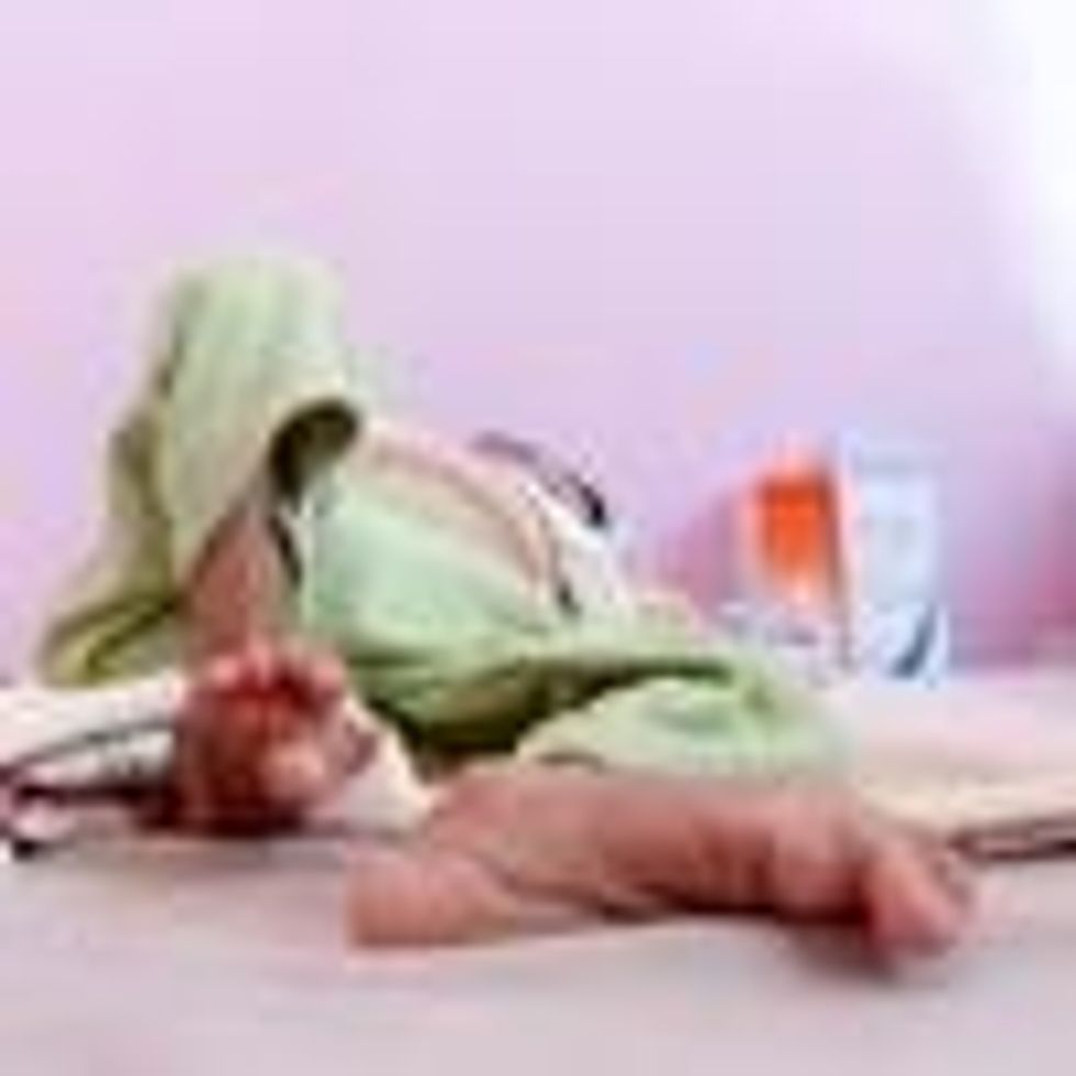 A malnourished child lies on a bed at the malnutrition treating ward in a hospital in Sanaa, Yemen, March 13, 2022.