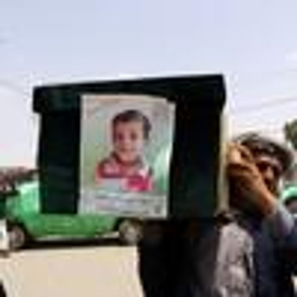 A man carries the coffin of a child at the funeral procession for those killed in an airstrike on a bus carried out last week by a warplane of the Saudi Arabia-led coalition on August 13, 2018 in Saada, Yemen.