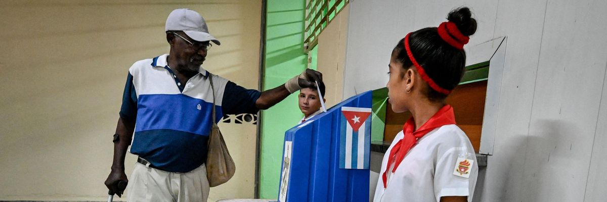 A man casts his vote in the referendum on Cuba's Family Code