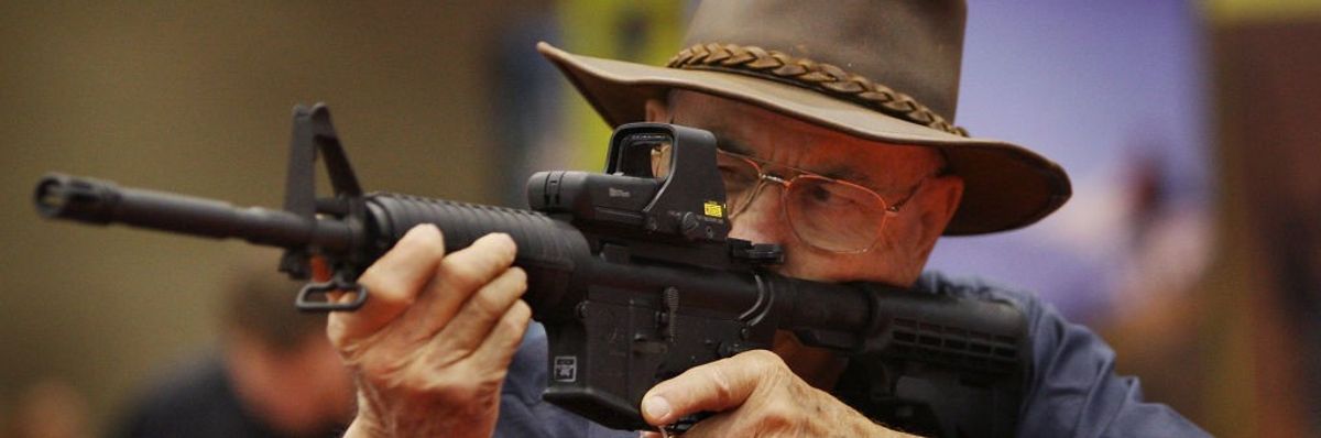 A man checks out an ArmaLite rifle
