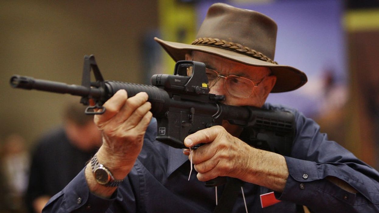 A man checks out an ArmaLite rifle