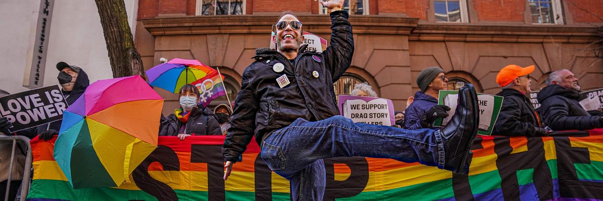 A man dances with supporters of New York's LGBTQ community in solidarity with Drag Queen Story Hour.