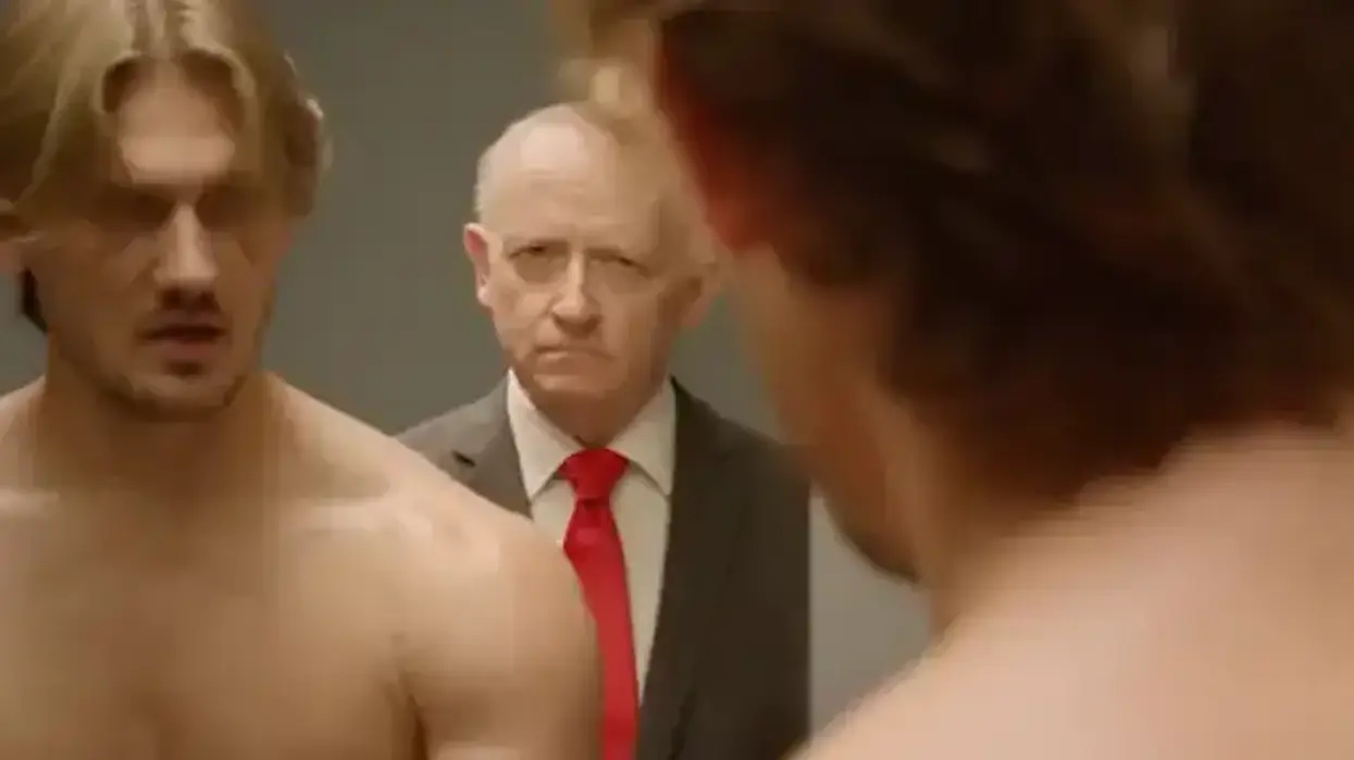 A man gets Plan B from a cabinet during a political ad.