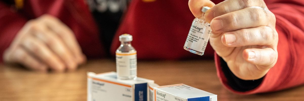 A man looks at NovoRapid, a Canadian insulin medication, and NovoLog, the U.S. version,