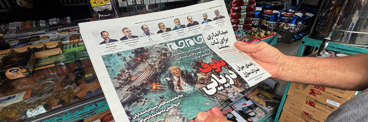 A man looks at the front page of the Jam Jam newspaper