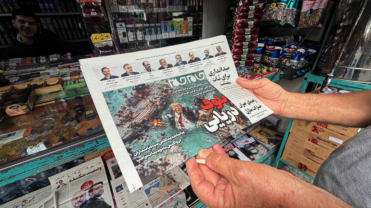 A man looks at the front page of the Jam Jam newspaper