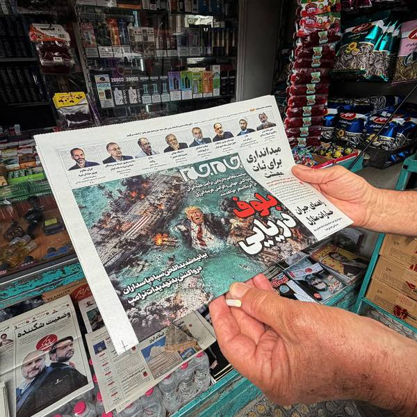 A man looks at the front page of the Jam Jam newspaper