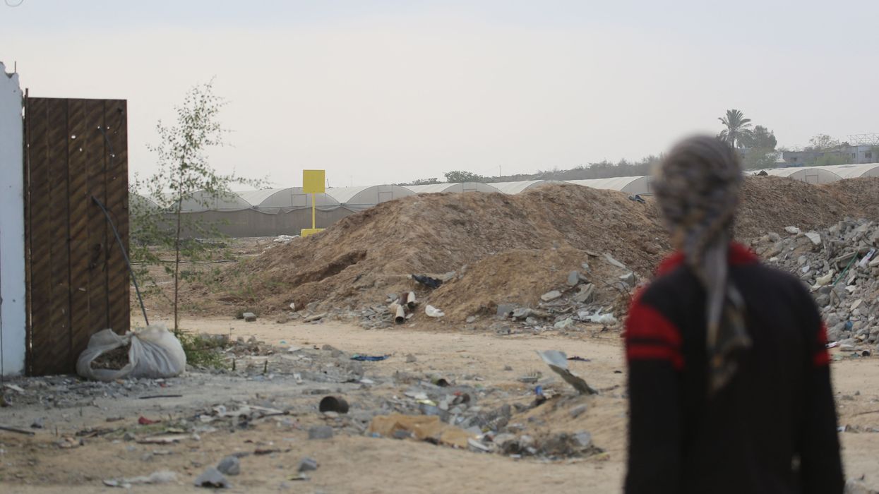 A man looks at the "Yellow Line" in Gaza.