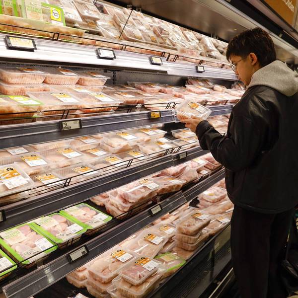 A man seen checking the meat price at a Woolworths supermarket in Melbourne, Australia