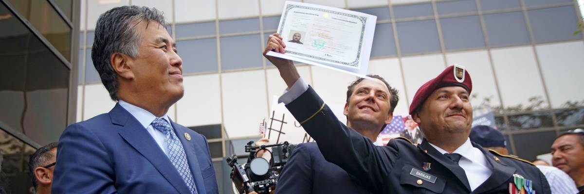 A man shows his US citizenship papers.