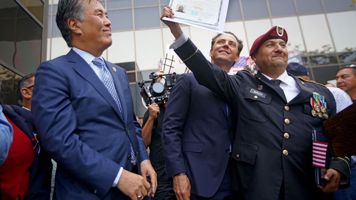 A man shows his US citizenship papers.