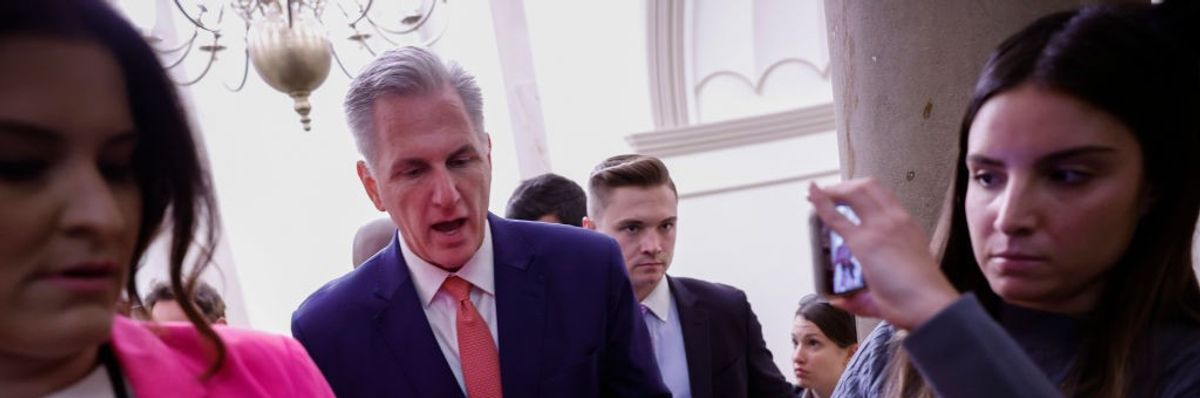 A man walks towards the camera in a suit.