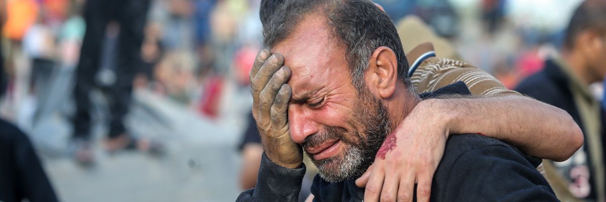 A man weeps after his home was razed by Israeli strikes in Khan Younis
