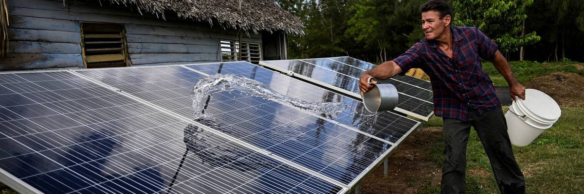 A man with solar panels in Cuba.