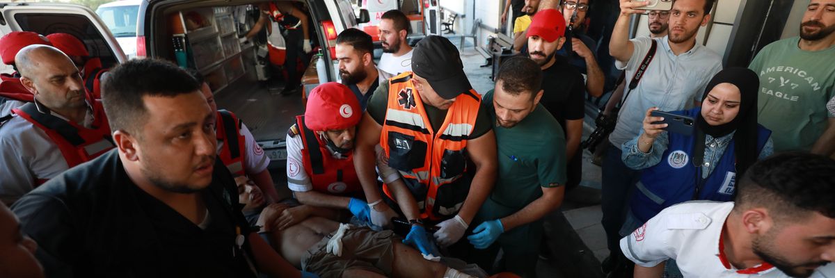 A man wounded by Israeli forces is taken to a nearby hospital for treatment in Jenin, West Bank
