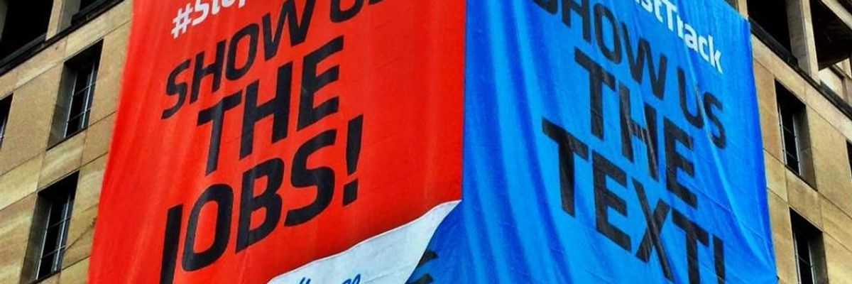 A massive banner was unfurled Tuesday outside the AFL-CIO headquarters near the White House