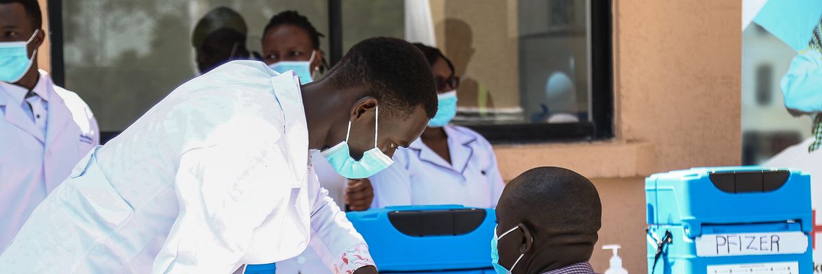 A medical officer administers a Covid-19 vaccine jab to a man at the Nakuru County Referral and Teaching Hospital in Kenya on June 6, 2022.